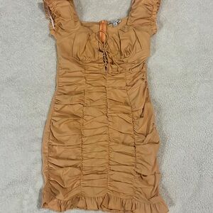 This dress is fitting and is very sexy. Also ties in the front.